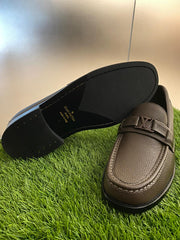 Louis Vuitton Major Loafers in dark brown grained calf leather.
