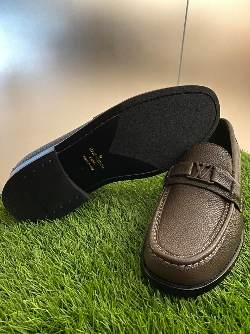 Louis Vuitton Major Loafers in dark brown grained calf leather.
