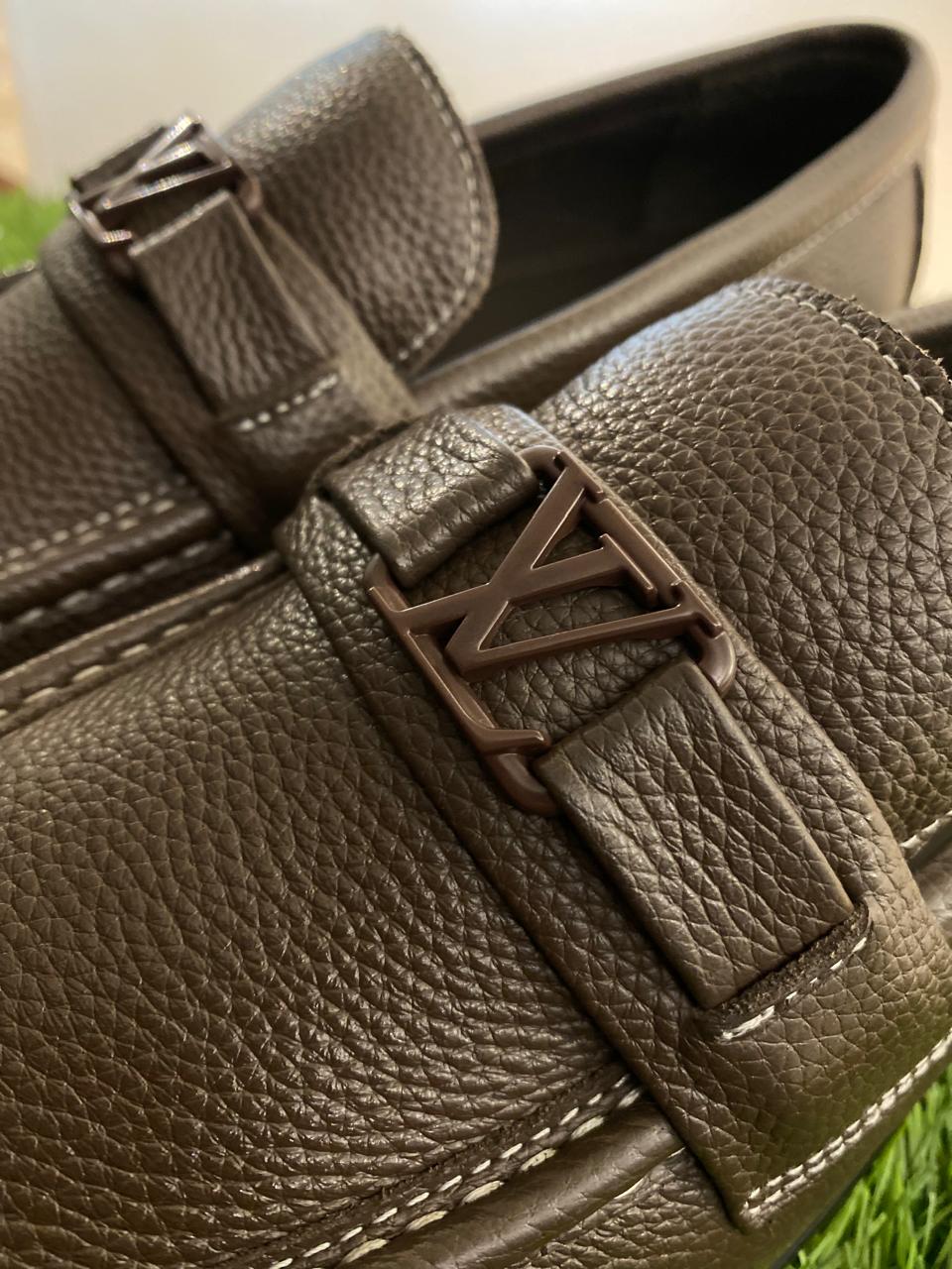 Louis Vuitton Major Loafers in dark brown grained calf leather.