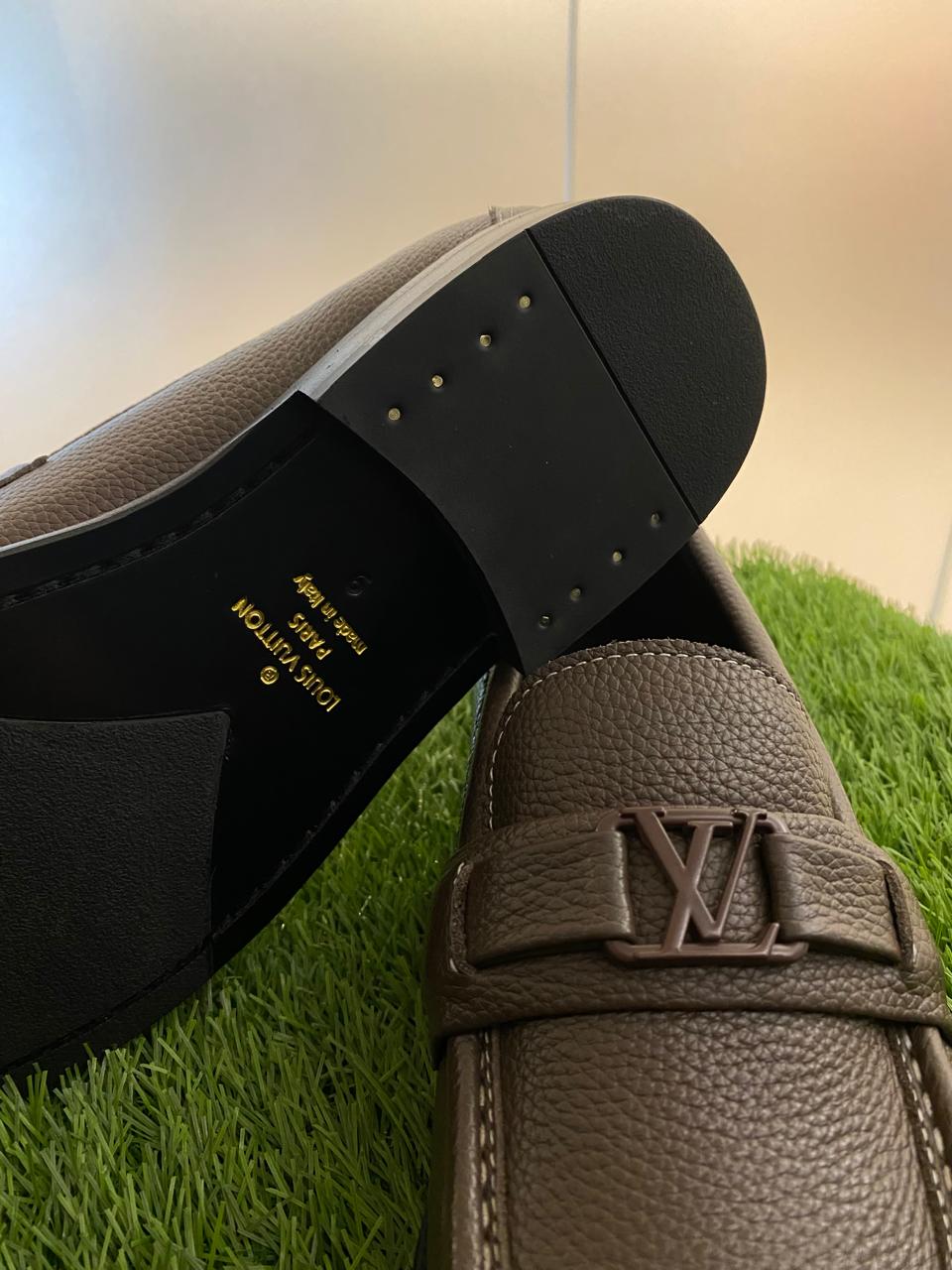 Louis Vuitton Major Loafers in dark brown grained calf leather.