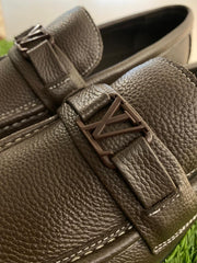 Louis Vuitton Major Loafers in dark brown grained calf leather.